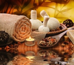 Outdoor spa massage setting at sunset with candlelight Deep Tissue Massage in Mumbai